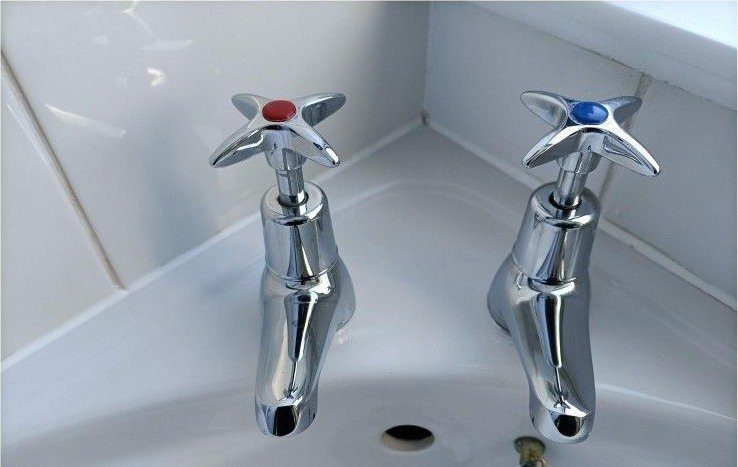 Bathroom taps and basin after Bright Path cleaning