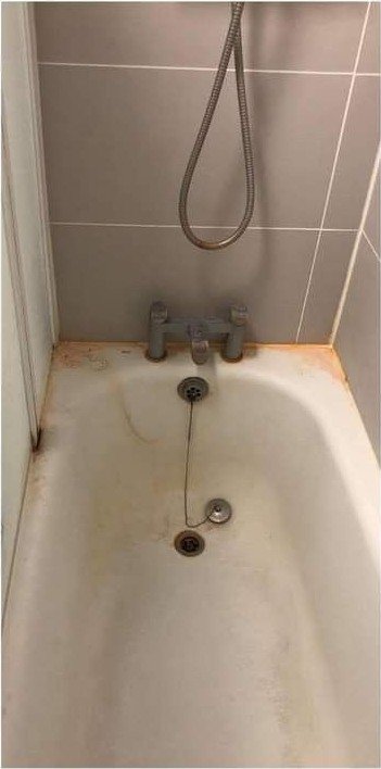 Bathtub detail before Bright Path cleaning
