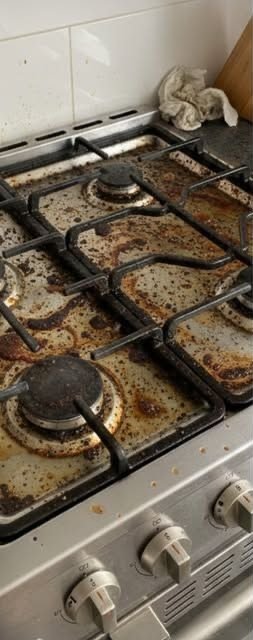 Gas stovetop detail before Bright Path cleaning